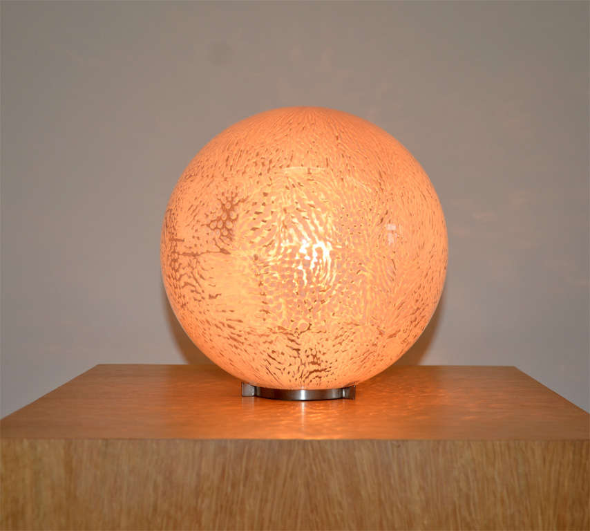 A rare "Murrine" table lamp, model 801.5, executed by Venini, glassworks in Murano, Italy.
Free-blown murrine ("Faraona") glass ball on a chrome-plated metal base.